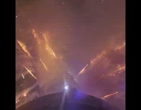 Collab Subway Creatures - Guy watches fireworks from skyscraper blue light