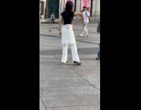 Woman black top tiktok dance at park