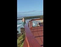 Green leggings girl rock beach sunset balcony