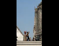 Man velvet top films outside the temple