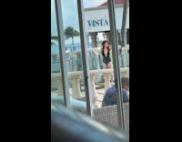 Woman black bikini poses at beach resort