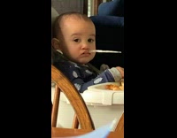 Baby keeps spoon in mouth 