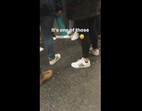 three people wearing white and black adidas shoes