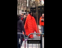 Man wear super oversized orange jacket street