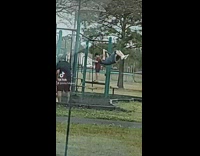 Guy on park swing after it breaks 