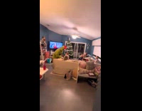 Person wearing grinch costume and scaring kids 