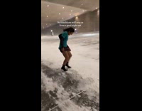Girl walking in snowstorm in skirt 
