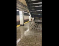 Water pours down inside subway train station