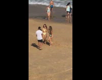 Two women bikini tiktok dance video beach