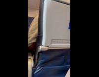 Flight Attendant sings national anthem inside airplane