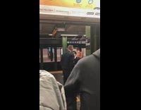 Woman wears pad as a face mask at station 