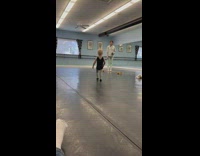 Little girl walking across balance beam