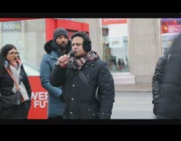 Woman blow smoke on man preaching on street