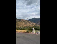 Helicopter collecting water for wildfire 