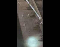 Guy picks up AirPods with a stick in train tracks 