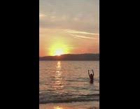 Girl bikini raise arms sunset beach sandals