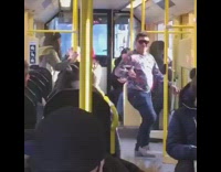 Sunglasses Pink Sweater Man Dances on Bus in Stockholm Sweden