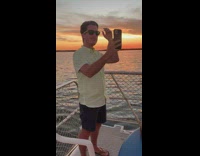 Man with sunglasses selfie video shoot on the boat