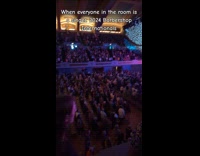 Crowd of singers harmonizing national anthem 