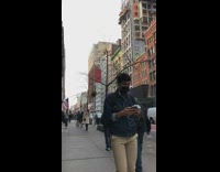 Red sweater girl sits and poses mailbox 