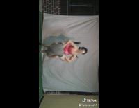 girl pink dress tries to flip guy