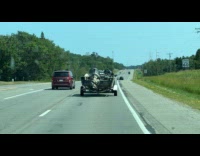 Seat spin of boat towed on road