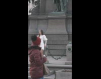 Woman white dress green horse statue 