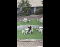 Woman selfie video alone on table outside