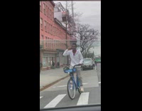Guy balancing basketball on head while riding bike says yes sir