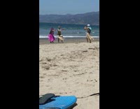 Guy girl hula dance grass skirt beach