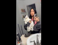 Cat squirming while being carried by hooman 