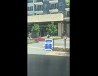 Girl red bikini dance video outside apartment