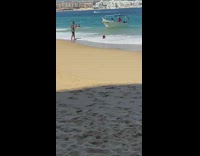 Woman bikini pink hat lie down beach