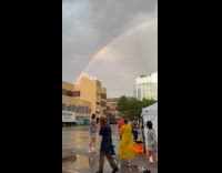 Collab WINY - Gathering of people look at rainbow sky