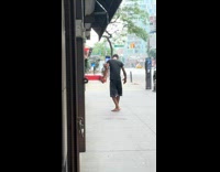 Collab WINY - Guy black shirt spin around on street