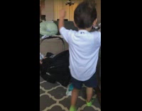 Kid white dodgers shirt falls wood floor 