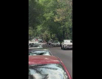 Two people in gray outfit tiktok dance in the street