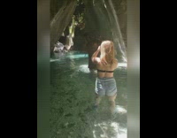 Man carries his bag on top of his head cave tunnel