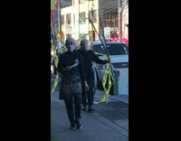 Collab winy - Guy clear bubble helmet blue poles sidewalk 