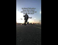 Man Dances on a Lot then Chased by Car