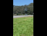 Guy white shirt sit grey car road