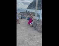 Two women in beach dress tiktok dance at the shore Part 1