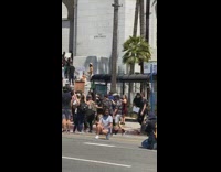 Woman sit sidewalk photo shoot protest