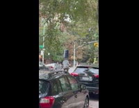 Man ride bike balance luggage on head