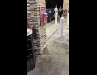 Guy white shirt poles twin braids car