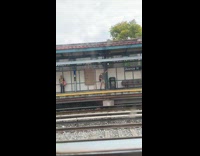 Collab winy - Man hitting signage with silver chain 