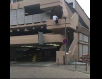 Guy tries to do parking garage parkour fail 