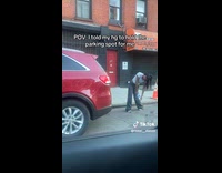 Woman secures parking space with crackhead pose