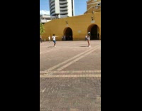 Guy white shirt dance yellow wall car