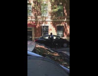 Guy walking outside yells chocolate into microphone 